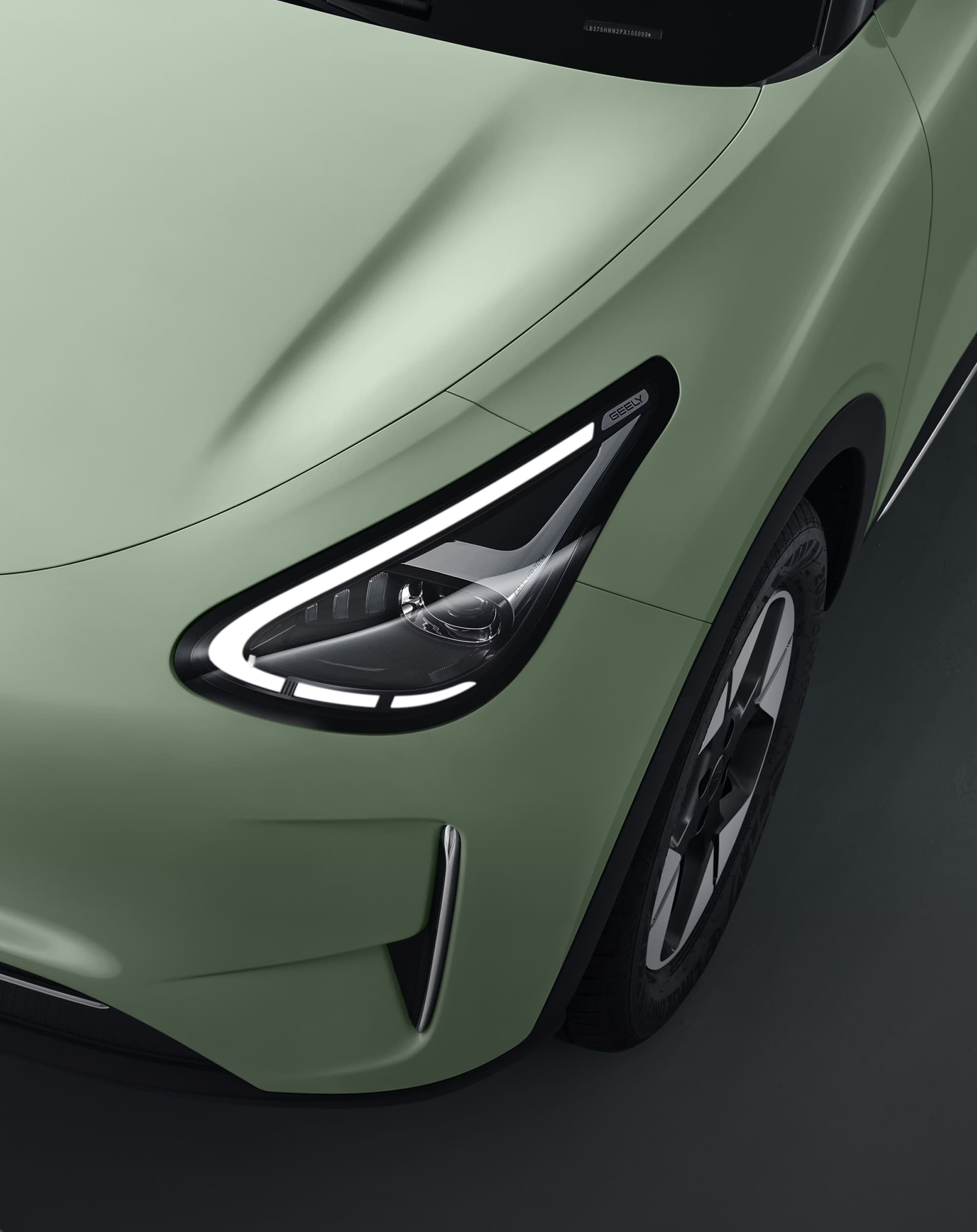 Geely E2 automatic LED headlights with signature daytime running lights